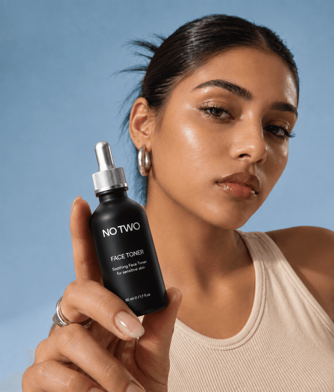 Model holding a NO TWO soothing face toner